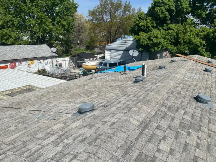 Roof with old turbine vents before replacement