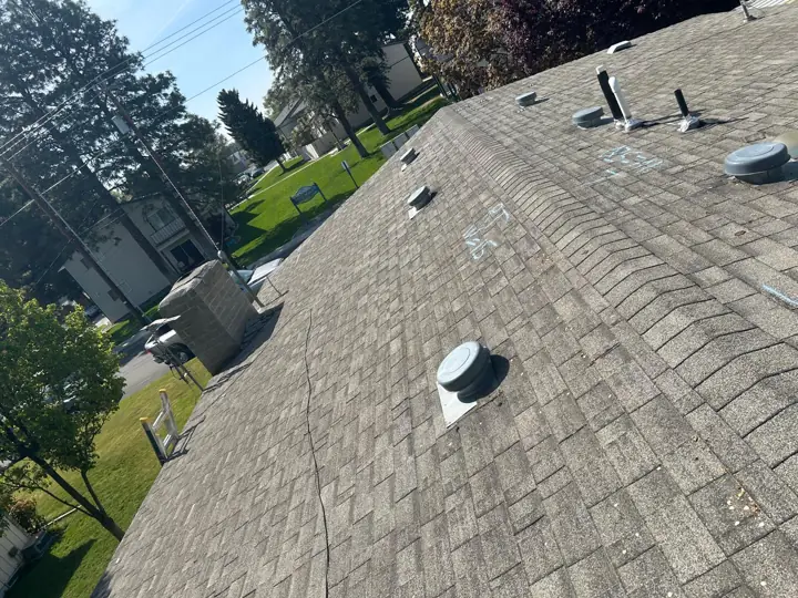 Worn roof with aging pipe boots before repair