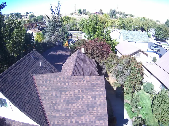 Aerial view of a brown shingle roof