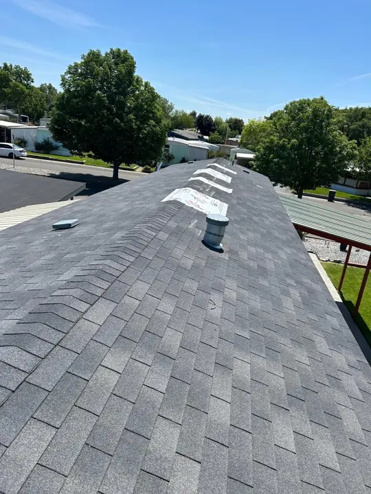 New ridge cap and shingles on a finished roof