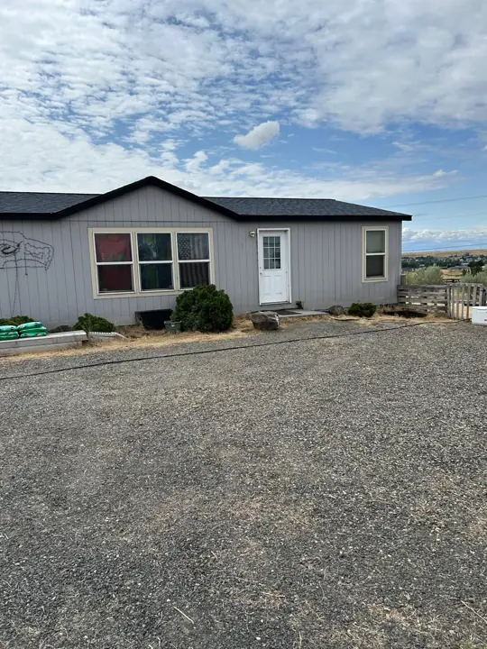 Ranch-style home exterior after roofing