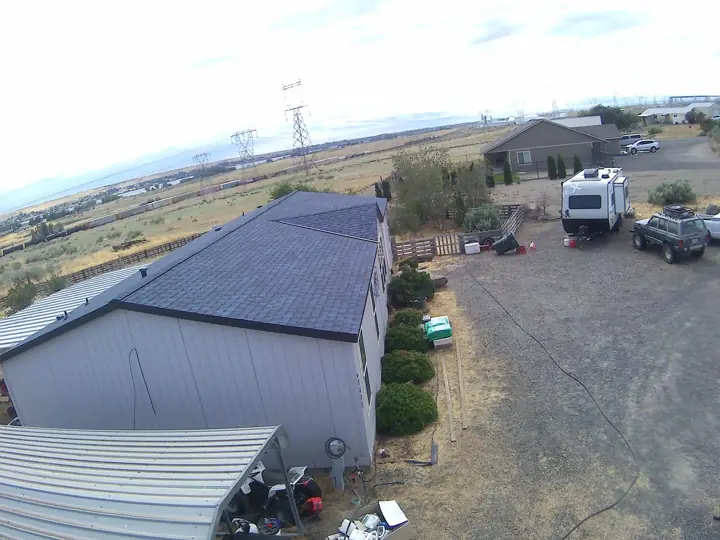 New dark shingle roof on a rural Eastern Oregon home